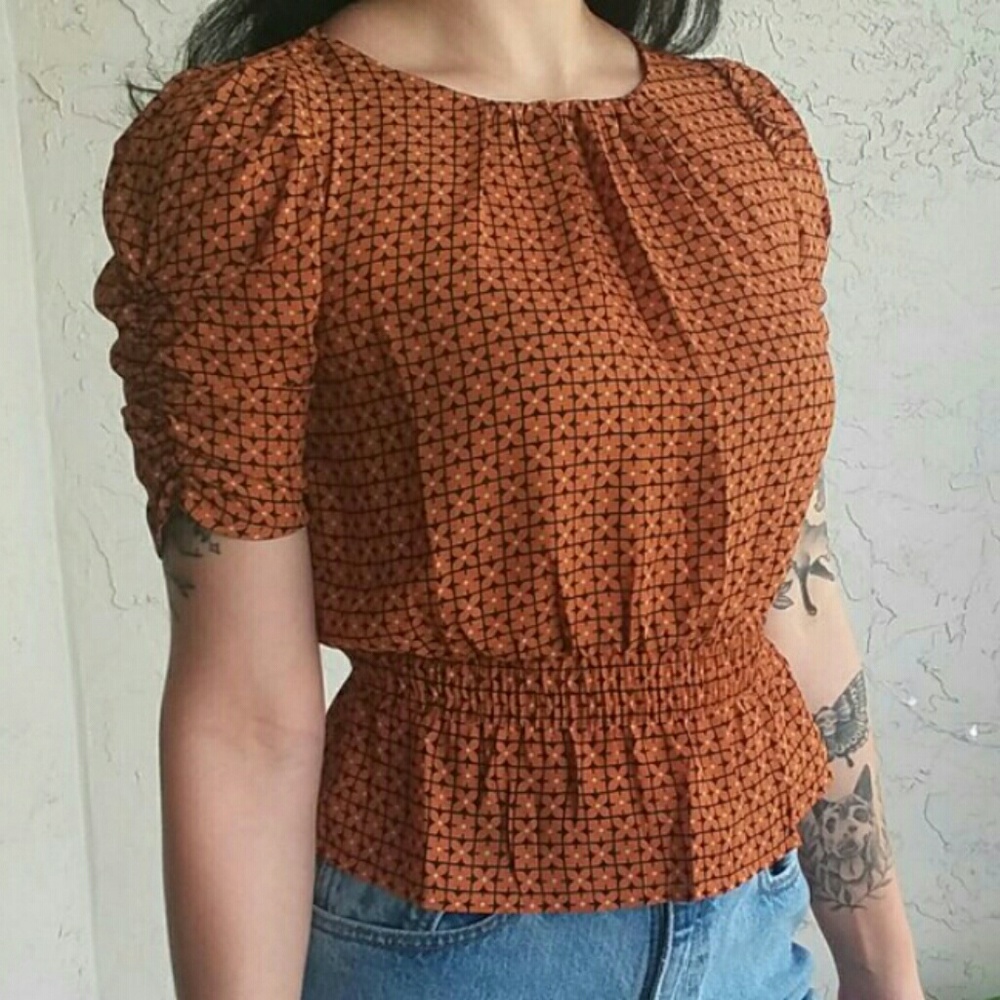 rust peplum top